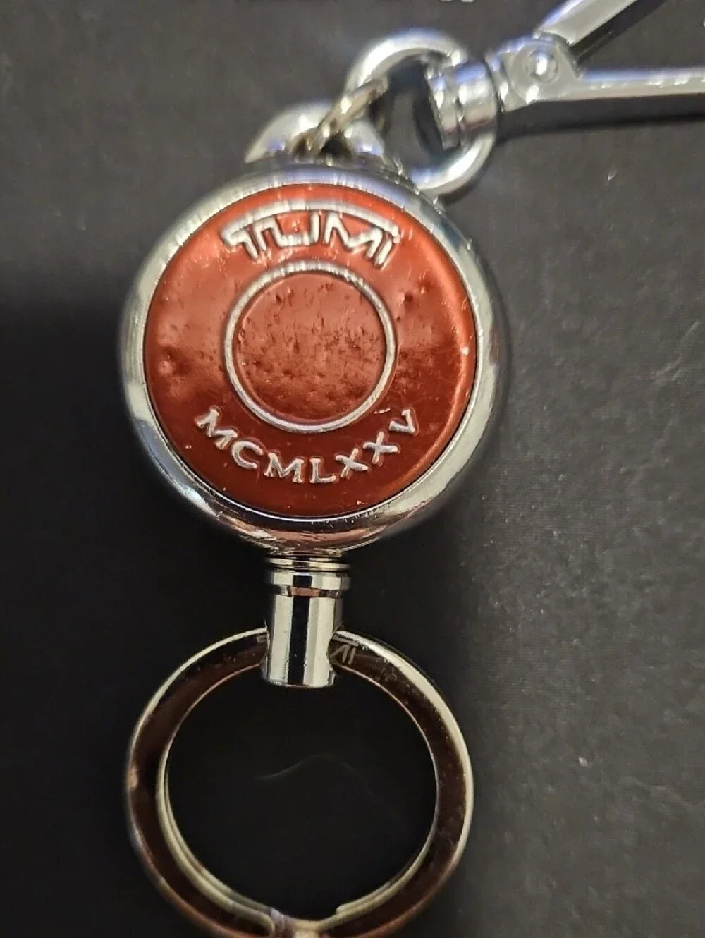 Tumi Orange Round Key Fob with Silver Hardware-retractable